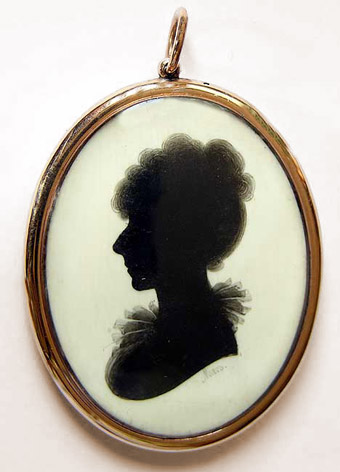 Locket with silhouette to centre, by Meirs, gold surround, ivory ground