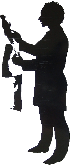 Full length silhouette of a silhouette artist facing left cutting a full length silhouette of a man